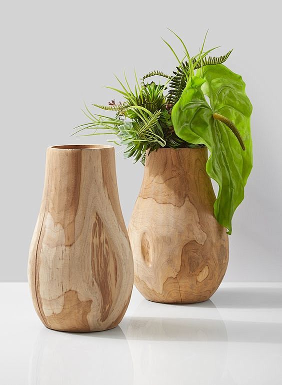 Our teak wood vase i...