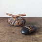 Pebbles woven with rattan by Deloss Webber.