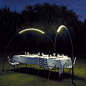 The Halley Outdoor Light : Inspired by Halley’s Comet, this light has an semi-circle shape with a built in LED Light Strip so as to bathe outdoor dining or seating in warm light. The fixture is waterproof.