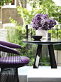 Kelly Hoppen Couture - Kelly Hoppen Interiors like the idea to match flowers to feature furniture: