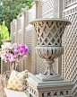 Trianon vase and pedestal in Le ­Manach’s garden......I love the FENCE in the background! Gorgeous!