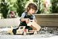 Switzerland, Lucerne, Boy playing with toy truck