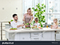 stock-photo-happy-family-having-breakfast-at-home-584682607