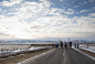 A torch bearer gallops, accompanied by riders in folk costumes, during a torch relay near Ulan Ude, eastern Siberia, on November 22, 2013.(AP Photo/Olympictorch2014.com)