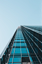 low angle photography of clear glass high-rise building