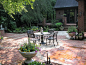 Patio fountain - mid-sized traditional backyard brick patio fountain idea in Atlanta with no cover