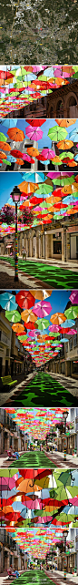 Floating Umbrella Installation：葡萄牙águeda 的大街上被悬挂成荫各色雨伞形成了一道独特的风景线。色彩斑斓的顶棚给人们带来不只是阴凉，还有欢快愉悦的心情。走在这个下面人们应该都是轻松的~:tcnzTtJ9D 