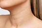 Premium Photo | Closeup of a young blonde womans neck on a white background lines and wrinkles on the neck