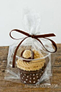 Great idea for take home cupcake.  Clear plastic cup in a clear goodie bag tied with ribbon.