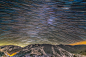 Alborz Mountain Star Trails 
Image Credit & Copyright: Stéphane Guisard (Los Cielos de America, TWAN)
Explanation: Colourful star trails arc through the night in this wide-angle mountain and skyscape. From a rotating planet, the digitally added consec
