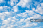 Cumulus clouds in blue sky创意图片素材 - Photographer's Choice