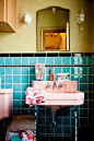 pink and turquoise bathroom is so 50's with colored fixtures and tiles