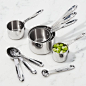 Set of 5 All-Clad ® Measuring Cups : Shop Set of 5 All-Clad ® Measuring Cups.  Designed to match All Clad cookware, four saucepan-shaped stainless steel measuring cups are well balanced and provide accurate measurement.   Set includes ¼, 1/3, ½, 2/3, and 