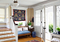 Inspiration for a large timeless light wood floor entryway remodel with yellow walls and a white front door