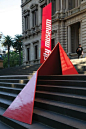 The team designed bright red "folded" monumental signs that are "contemporary insertions" into the historic setting (an approach not appreciated by some more conservative members of the public, according to emerystudio). The 25mm and 4