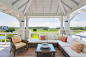 Balcony - large coastal balcony idea in Charleston