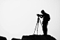 Silhouette of Man Holding Camera