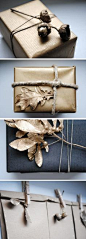 Add gold spray paint to natural elements like acorns and leaves to embellish your packages. #giftwrap