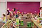 The bright colours and low level books are key to this children's library space. How To Design Library Space with Kids in Mind.: 