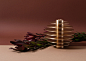 Set of seven candle holders ORB : ORB is a set of seven metal candle holders stacked on top of one another to form a modern spherical sculpture. Designed to be functional, each candle holder has two sides to hold long and tealight candles. 