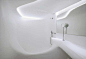 bathroom_fluid_space_thermoformed_acrylic_hotel_puerta_america_zaha_hadid_surface_macs_continuous_finish_plastic_sheet_panel_wall_ceiling
