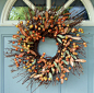 Crown your front door with berries, foliage, pinecones and other decorative touches that convey a warm fall welcome