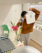Photo shared by Aeiou 아에이오우 on April 11, 2023 tagging @aeiou_official, and @_159_1. May be an image of 1 person, duffle coat, white lily, cornflower and baby's-breath.