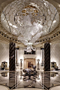 Modern Entryway with Lasvit custom glass installation, Chandelier, simple marble floors