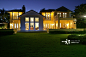 Nighttime view of a contemporary home with lavish lighting