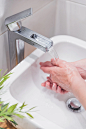 vertical-shot-female-handwashing-with-soap-water_181624-29569