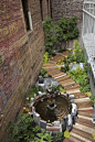 The Hummingbird Garden, designed and built by Organic Mechanics, is nestled between two old high-story brick buildings, behind the Mark Twai...