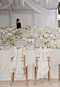 All white with lace/eyelet chair ribbon. Forget Me Not Flowers.