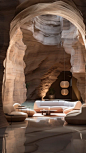 a natural stone archway with couches and chairs outside, in the style of fluid abstraction, spectacular backdrops, layered surfaces, wavy resin sheets, porcelain, expansive spaces, wallpaper