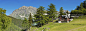 Picturesque Alpine chalet summer mountain meadow panorama_创意图片