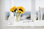 Vase of flowers and coffee cups on kitchen table by Caia Images on 500px