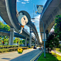 This may contain: a cartoon character hanging from the side of an overpass