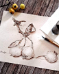 This may contain: a pencil drawing of onions on paper next to some paintbrushes