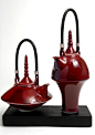 Ceramics by Melanie Brown at Studiopottery.co.uk - 2006. Variation Two - Sang de boeuf teapots on a beech block: 