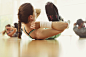 Woman doing bicycle sit-ups in exercise class by Caia Images on 500px