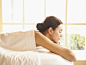 Woman with eyes closed lying on massage table at a luxury spa in Napa, California by Gable Denims