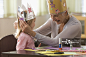 Caucasian grandmother and granddaughter doing arts and crafts together