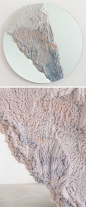 Designer Fernando Mastrangelo has created the Escape Collection, a group of modern furniture pieces, like this mirror, that are made using hand-dyed sand and silica to create simple forms that look like a three-dimensional landscape painting.