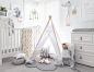 White, Nordic-inspired nursery with teepee