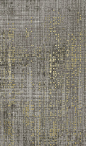 a gray and yellow rug with gold dots on the top, in an abstract pattern