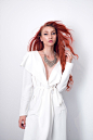 woman in white plunging neckline long-sleeved dress