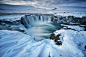 time lapse photography of waterfalls in snow