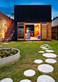 10 Ideas for Stepping Stones in Your Garden // Round stepping stones scattered throughout the yard of this home create paths and fun places to practice hopscotch skills.