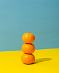 orange fruit on yellow surface