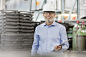 Portrait confident engineer with clipboard in factory by Caia Images on 500px