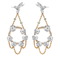 The chandelier earrings from Theo Fennell's new Hummingbird and Hibiscus Suite in 18ct white gold, set with luminescent Paraiba tourmalines (£8,750).